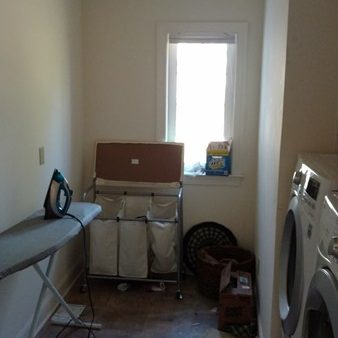 Laundry Room Before | Sovereign Construction Services